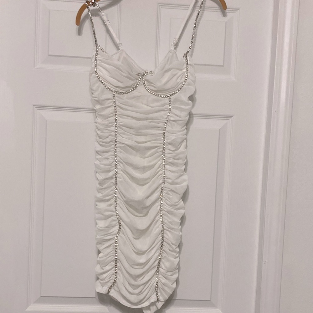 White eden sky dress . Size large but it runs small. Very sexy.